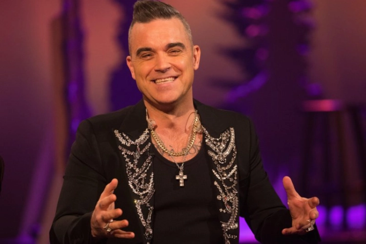 Robbie Williams maakt zich erg veel zorgen om familielid: “De groei van de kanker neemt niet af”